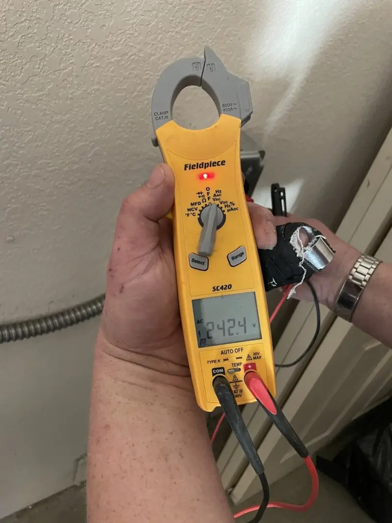 Voltage testing with clamp meter during Electrical Installation Services in Penrose